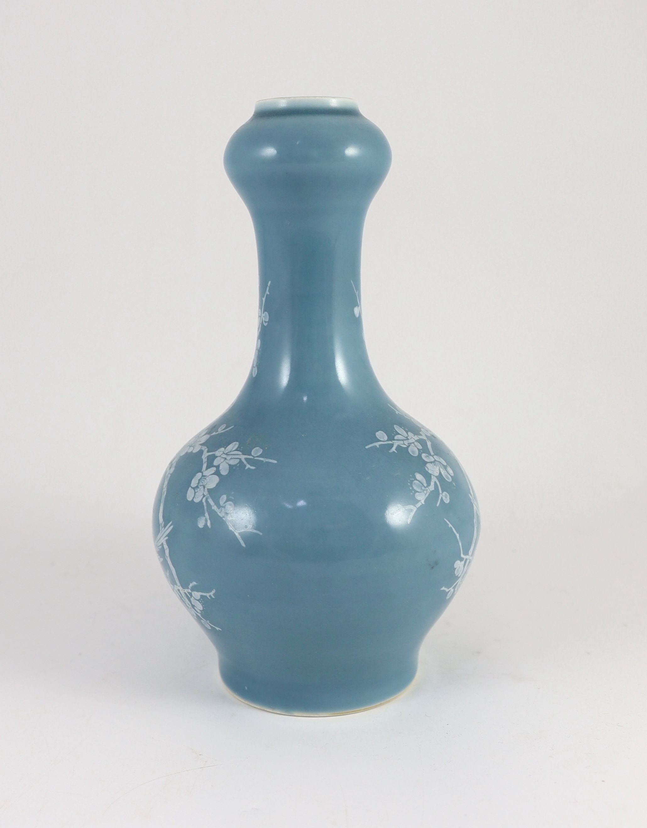 A Chinese claire de lune glazed white slip decorated vase - 25cm high